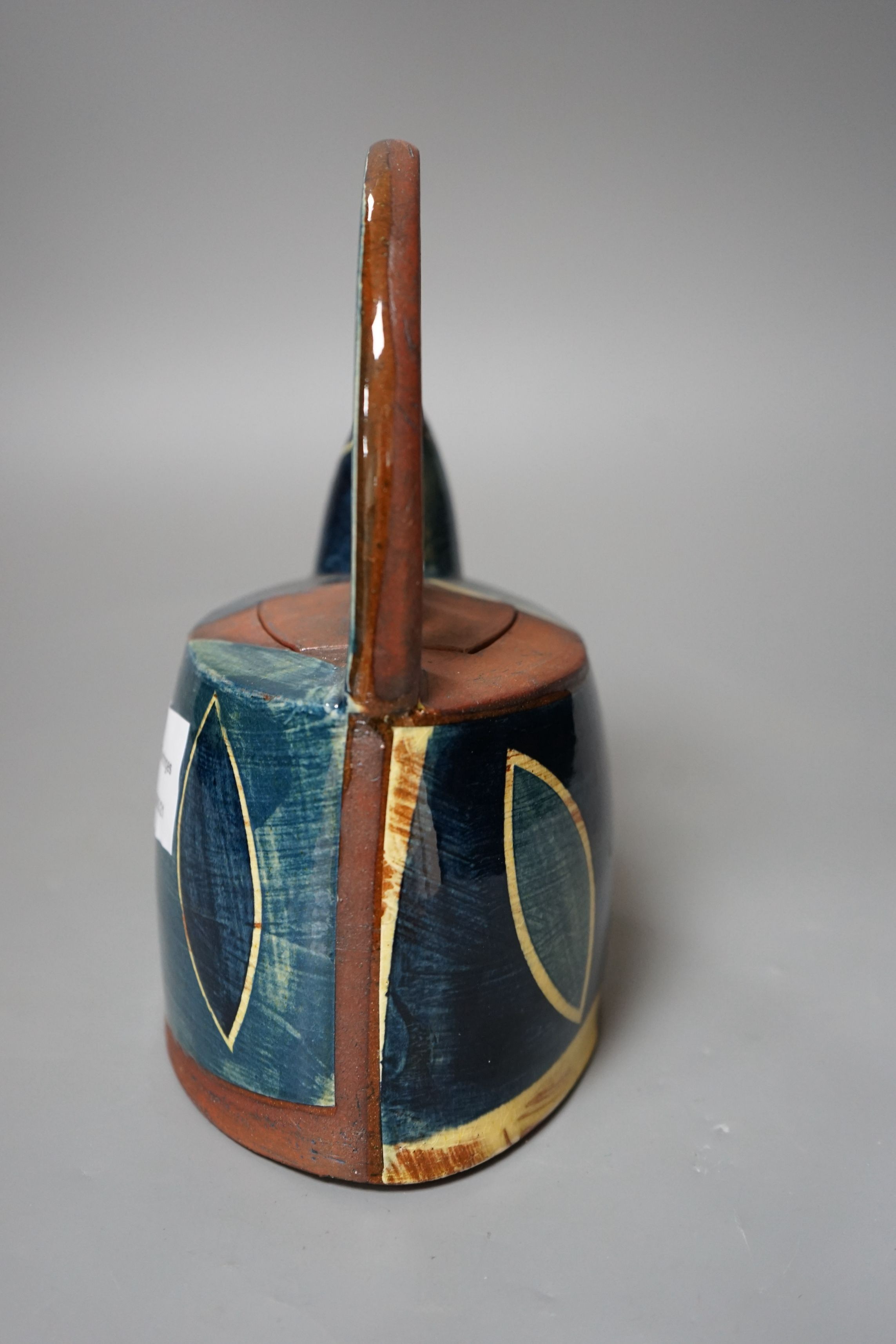 Richard Phethean (b.1953), an abstract green yellow and blue glazed earthenware teapot, purchased from Craft Potters Association contemporary ceramics centre, 63 Great Russell Street, London, 23cm tall